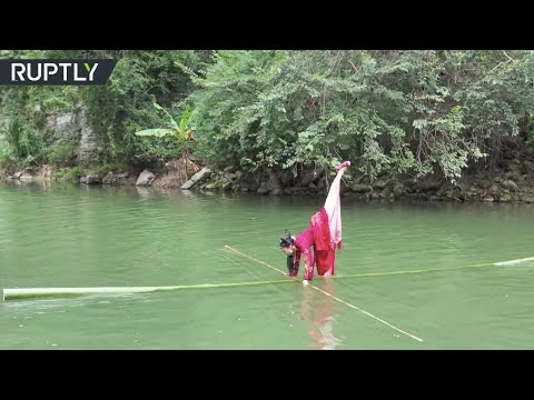 'Duzhu Drift' | Chinese artist performs on floating bamboo pole