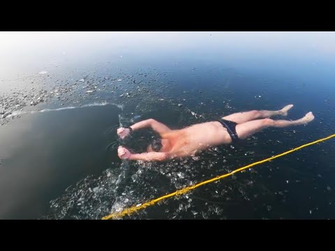 Man Swims Under Frozen Lake