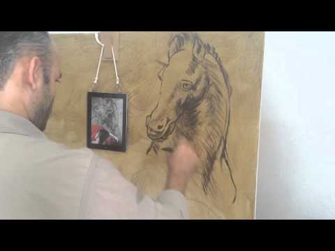 Omar Ortiz pintando la obra los caballos de Da Vinci Hiperrealismo Hyperrealism oil paint